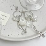 Women's super-fairy long petal pearl tassel earrings, minimalist, luxurious, niche design with a sense of high-class and elegance.