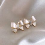 Korean high-end bow stud earrings for women, with a niche and stylish design. New styles for 2025.