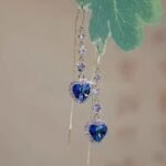 New style fashionable imitation blue crystal earrings, heart-shaped diamond-encrusted ear wires, women's long heart-shaped pendant ear wires with a sense of luxury.