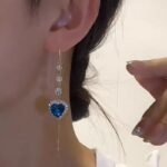 New style fashionable imitation blue crystal earrings, heart-shaped diamond-encrusted ear wires, women's long heart-shaped pendant ear wires with a sense of luxury.