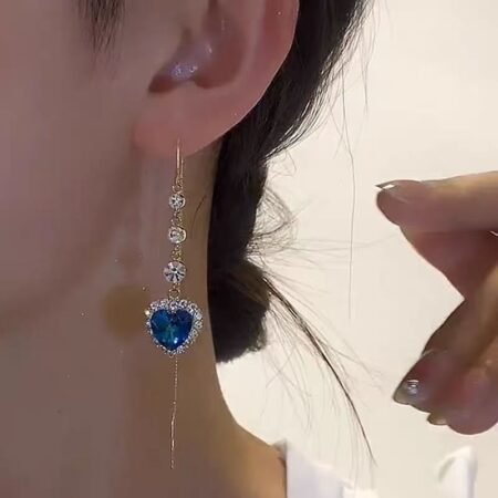 New style fashionable imitation blue crystal earrings, heart-shaped diamond-encrusted ear wires, women's long heart-shaped pendant ear wires with a sense of luxury.