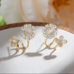 Light luxury, fashionable and high - end cat's eye stone flower earrings, new summer style with niche design and delicate stud earrings