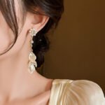 Women's super-fairy Baroque pearl shell earrings, long and gentle tassel earrings, new and niche high-end jewelry