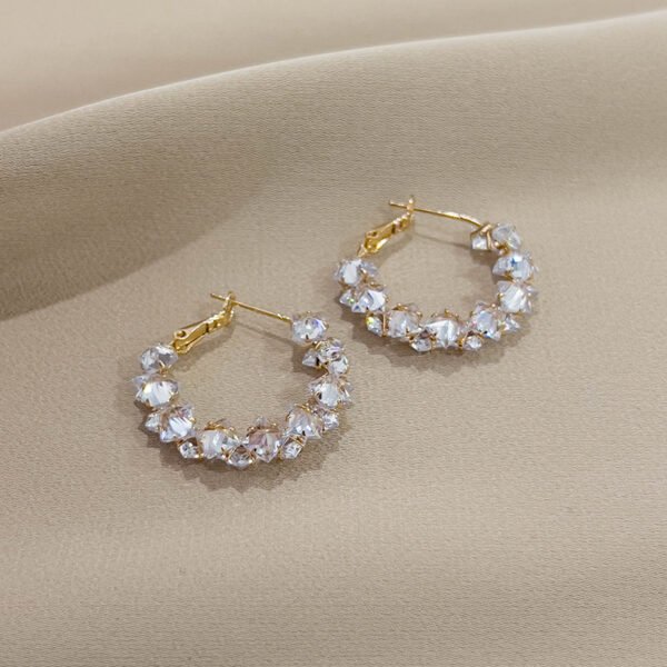 Super sparkly crystal ear loops. These are luxurious, fashionable, versatile, and have a niche and high - end feel. They are Korean - style creative earrings.