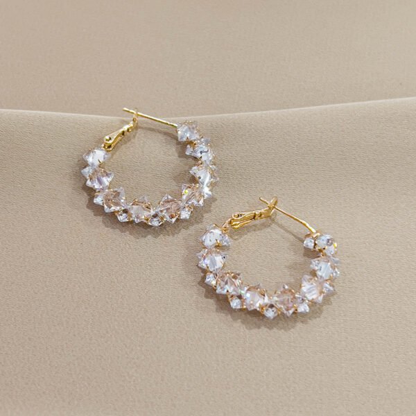 Super sparkly crystal ear loops. These are luxurious, fashionable, versatile, and have a niche and high - end feel. They are Korean - style creative earrings.