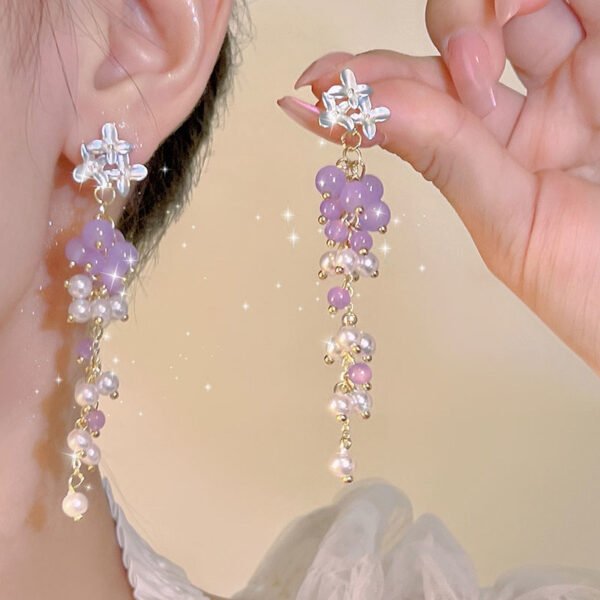 Popular small and fresh butterfly and flower stud earrings in spring 2025. Light luxury and versatile long tassel pearl earrings and ear accessories.