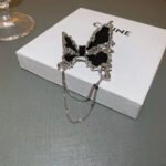 New-style French light luxury butterfly brooch with tassels, a unique and elegant accessory for blazers, sweaters, etc.