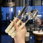 Luxury and high-end stainless steel steak cutlery set with high appearance value, including knife, fork and spoon. A complete set of Western tableware, also a three-piece cheese set.